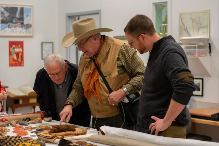 People looking at artifacts