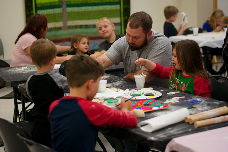 Family making salt dough ornaments